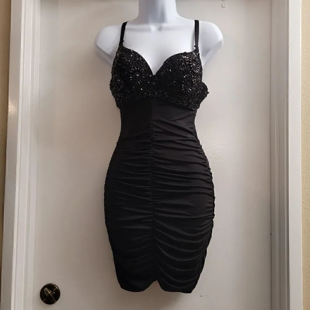 Easel Black Madonna style dress circa 90's with a beaded bra top.